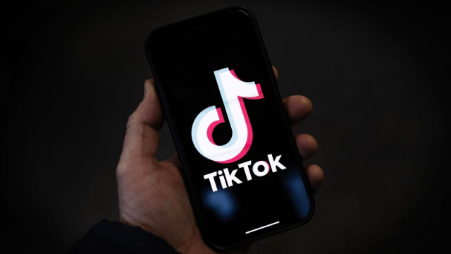 A TikTok logo is displayed on an iPhone.Getty Images